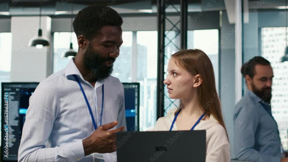 Poster female engineer and coworker coding ai algorithms to debug software issues and improving system stab