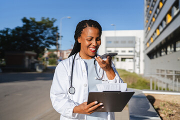 african american woman doctor reports results to the patient