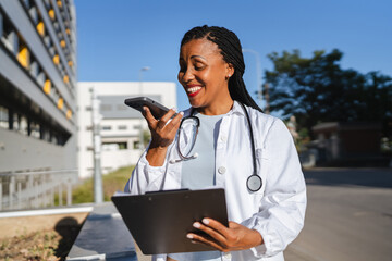 african american woman doctor reports results to the patient