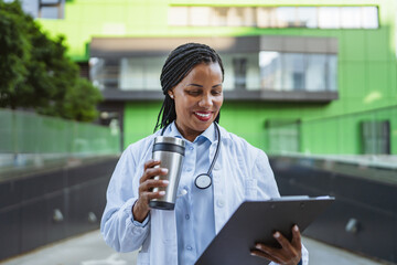 african american woman doctor examining clipboard prepare for patients