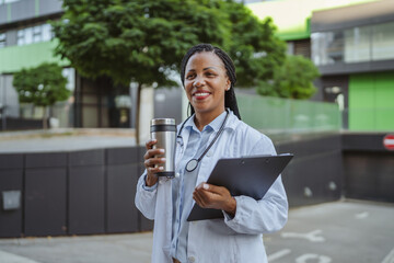 african american woman doctor examining clipboard prepare for patients