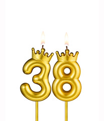 Golden number 38 birthday candle on white background