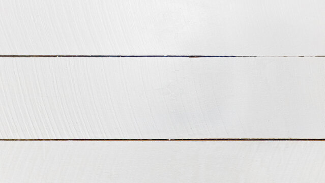 Background photo of three textured white wooden planks with copy space.