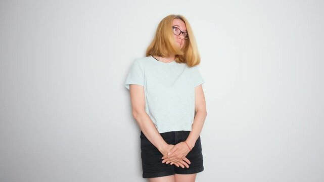 Middle aged woman sneezes and suddenly experiences bladder leakage, showing visible discomfort and embarrassment. A moment of stress incontinence associated with urinary health issues