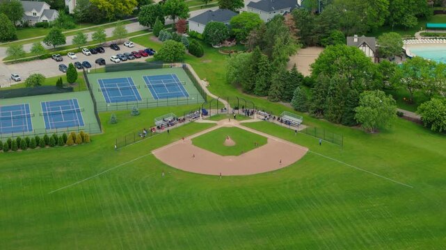 Baseball Players Playing During Match On A Sunny Day. Aerial shot footage