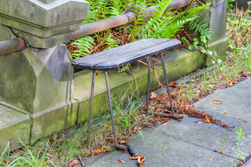 Stone garden edging with overflow drainage creating functional landscape water management system