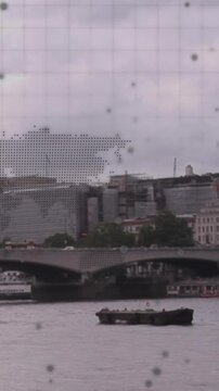 Animation of world map and data processing over london cityscape