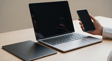 Modern Workplace Setup: Laptop, Tablet, and Smartphone