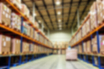 Fototapeta premium Blurred commercial shipping package warehouse, the atmosphere in the warehouse is full of package items ready to be sent to buyers, blurry wallpaper.