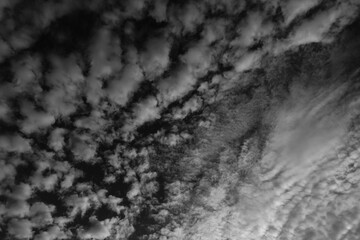 Dramatic high altitude abstract black and white clouds 