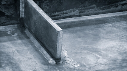 weld seam attaches a black metal part to another metal surface, metal welding industrial...