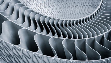 metal piece with a pattern created by a 3D printer. lines are arranged in a spiral pattern, creating a sense of movement and energy. Adaptive technologies concept background