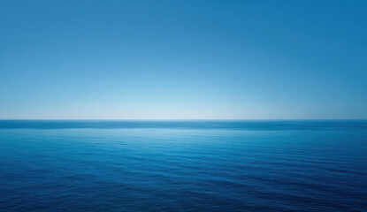 Fototapeta premium Vast Blue Ocean Surface with Clear Sky in the Distance