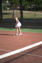 beautiful young woman playing tennis and possing outdoors, no edited image