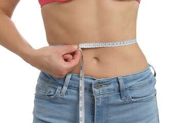 Woman measuring waist circumference on white background, closeup