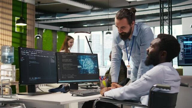 Startup engineer and colleague with paraplegia brainstorming, working with machine learning tech. Man in wheelchair and coworker in office transforming data into AI predictive models, camera A