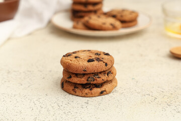 Sweet cookies with chocolate chips on white background