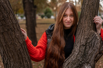 Young woman walking around the city and the parks in Autumn time. 