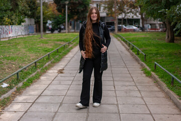 Young woman walking around the city and the parks in Autumn time.