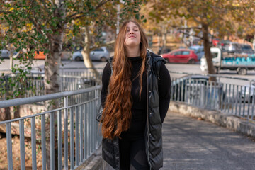 Obraz premium Unedited Portrait of a Young Woman Walking in the City – Facial Expressions Showing Various Emotions