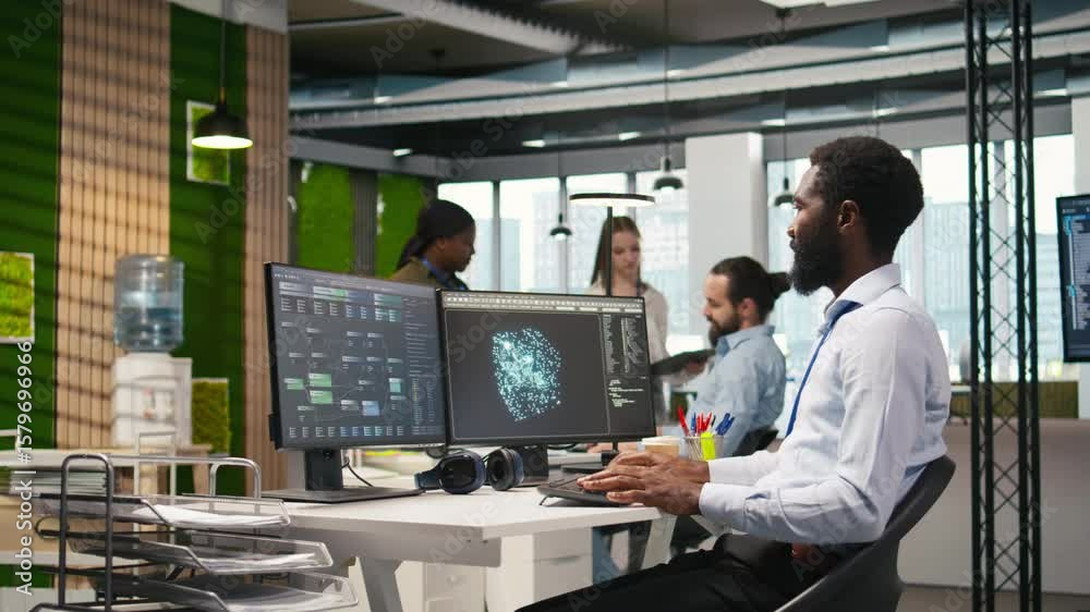 Fototapete programmer optimizing performance using ai llm chatbot recommendations. african american worker uses