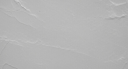 Textured gray surface with subtle, irregular creases and folds, resembling crumpled paper or stone.