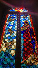 Stained Glass Window of Jesus with Doves in Church