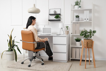 Young woman working in modern office