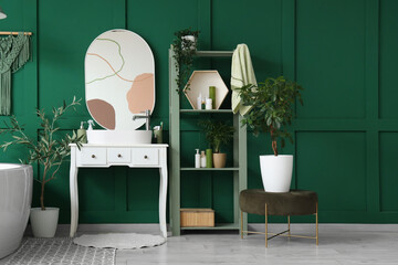 Interior of bathroom with sink, shelf unit and green plants