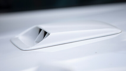 Close up of a car on a white sport car.