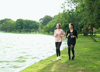 A young woman in sportswear is preparing to exercise in nature. Running for health and a good...