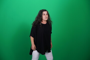 Unedited Portrait of Woman’s Face Expressing Various Emotions – Green Studio Background