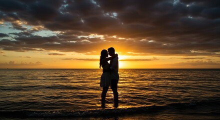Fototapeta premium Couple embracing sunset beach silhouette