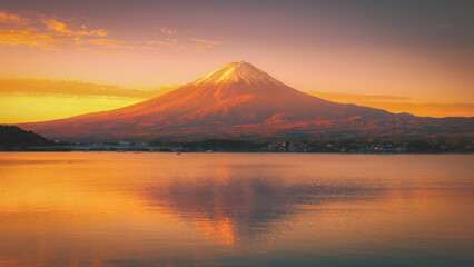 Fototapeta premium Landscape image of Mt. Fuji over Lake Kawaguchiko at sunrise in Fujikawaguchiko, Japan.