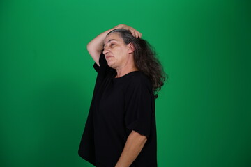 Unedited Portrait of Woman’s Face Expressing Various Emotions – Green Studio Background