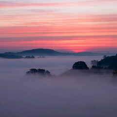sunrise moment at morning sky with pinky and some hills background