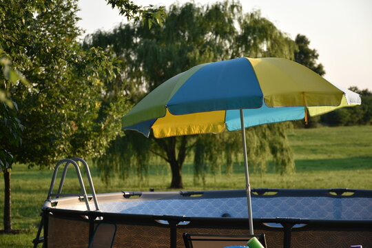 Umbrella by a Swimming Pool - Powered by Adobe