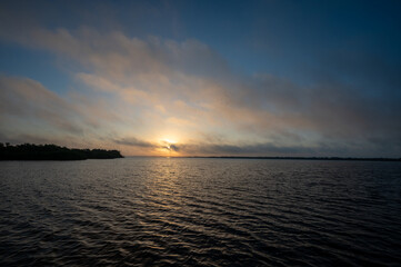 Colorful moody January sunrise cloudscape over West Lake in Everglades National Park, Florida.