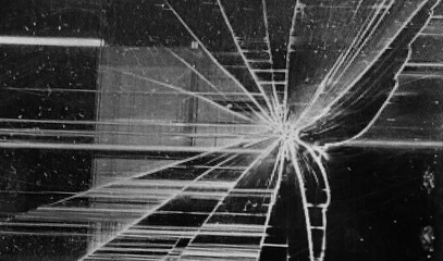 Overlay of shattered screen glass on a black background