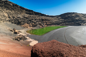 The stunning Lago Verde, or Charco de los Clicos, in Lanzarote. This vibrant green lagoon, set...