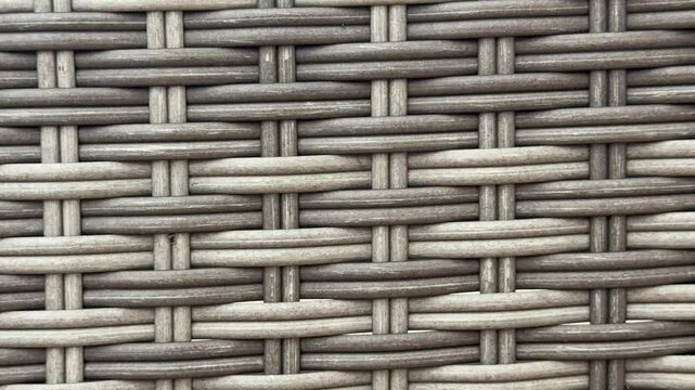 Close-up texture background of grey synthetic wicker or rattan