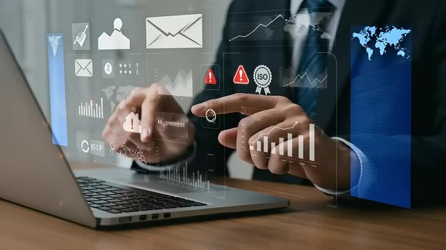 Businessperson using a laptop with overlayed data graphics - Powered by Adobe