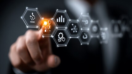 Person touching a futuristic digital interface with glowing hexagonal icons representing business concepts