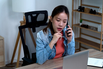 Businessman or freelancer in casual clothes using phone for work