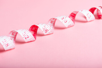 Pink Measuring Tape on Pastel Background