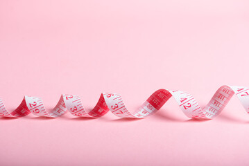 Pink Measuring Tape on Pastel Background