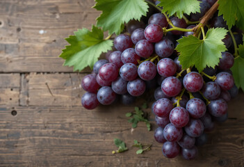 Fototapeta premium Luscious purple grapes with green leaves adorn a rustic wooden surface, evoking freshness and natural sweetness.