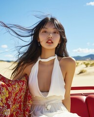 Confident Asian Woman with Flowing Hair in White Dress on Desert Adventure Trip