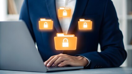 Businessman using laptop with glowing secure digital data folders floating above