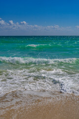 Wave motion on sea shore. Summer ocean breeze. Sea nature backdrop. Peaceful ocean. Dreamy ocean horizon. Coastal ocean paradise wallpaper. Seafoam waves. Azure water surface. Golden hour beach.